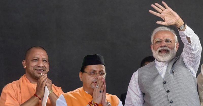 yogi adityanath and pushkar singh dhami with pm narendra modi